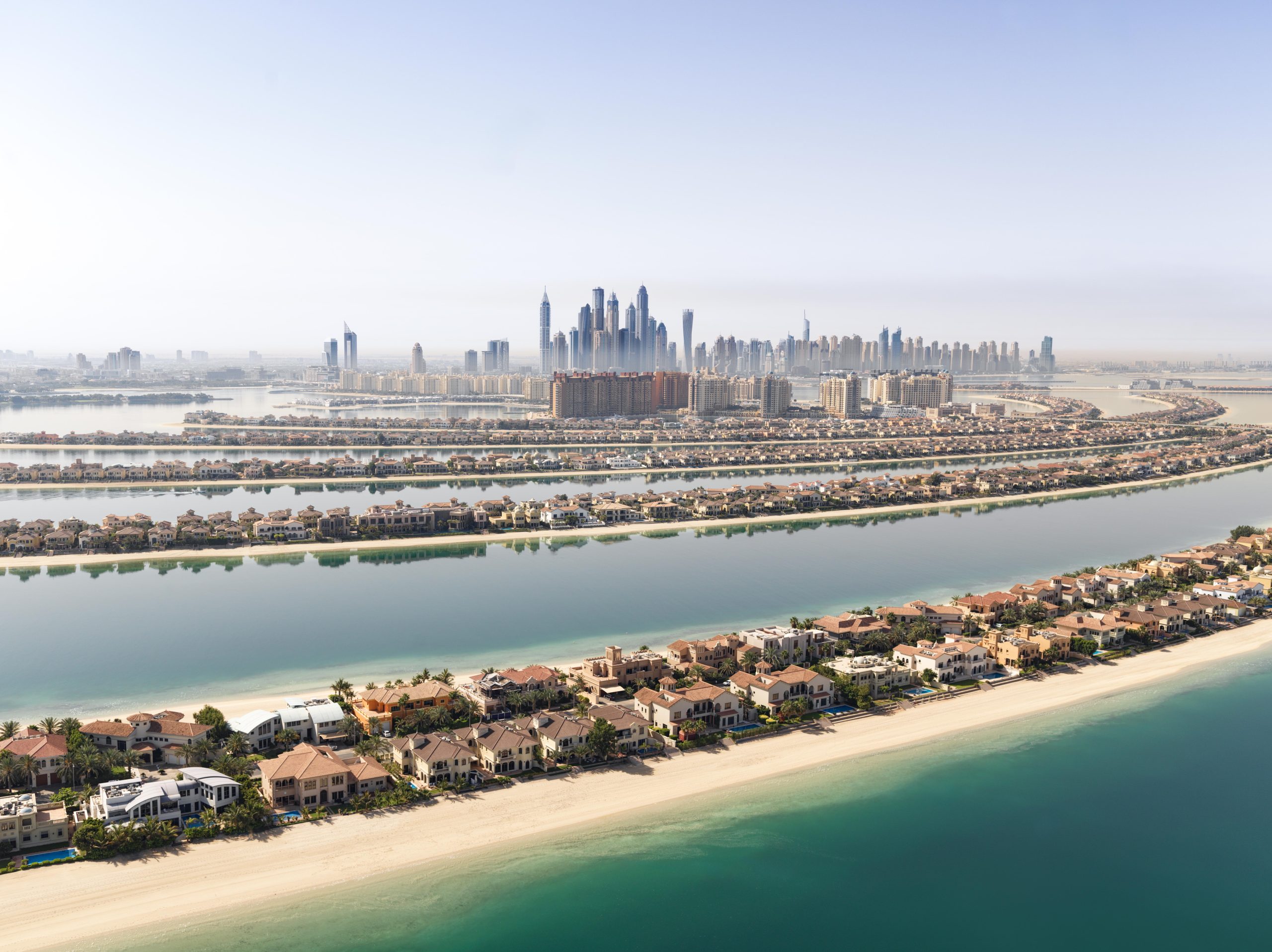 Aerial view of Palm Jumeirah and Dubai coastline beside the Arabian Gulf